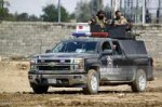 iraqi-police-leave-the-holy-city-of-najaf-as-they-head-alon[...]