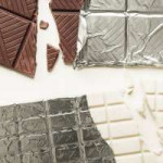 close-up-of-two-chocolate-bars-in-silver-foil-on-white-back[...].jpg