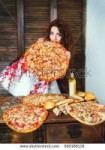 stock-photo-smiling-woman-eats-large-pizza-too-much-food-di[...].jpg