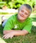 boy-in-green-shirt-with-downs-syndrome.jpg