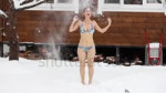 stock-footage-girl-in-a-swimsuit-washes-with-snow-in-winter[...].mp4