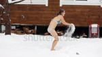 stock-footage-girl-in-a-swimsuit-washes-with-snow-in-winter[...].webm