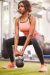 1280-481448634-woman-exercising-in-gym-with-kettlebell.jpg