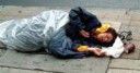 Homeless-Woman-Sleeping-on-Streets-in-Plastic-Bag.jpg