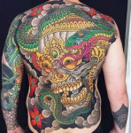 gold-skull-with-snake-guys-japanese-back-tattoo.jpg