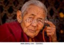 elderly-female-buddhist-monk-at-boudnath-stupa-boudnath-kat[...].jpg