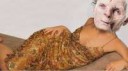 Sandra-Bullock-Smiling-Laying-Pose-In-Golden-Dress.png