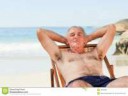 man-lying-down-his-deck-chair-18495009