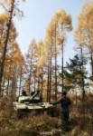 PLA type 99 tanks practise attack drills through forest 7.jpg