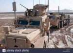 a-mine-resistant-ambush-protected-truck-front-and-an-mrap-h[...]