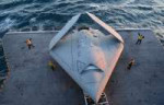 U.S.SailorsmoveaU.S.NavyX-47BUnmannedCombatAirSystemdemonst[...].jpg