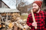 6852657stock-photo-smiling-lumberjack-holding-axe.jpg