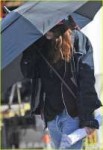 kristen-stewart-shields-herself-umbrella-06.jpg