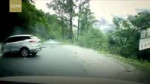 Car hit by huge boulder rolling down the side of a mountain.mp4