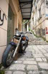 wall-murals-motorcycle-parked-in-a-paved-road-of-corfu-isla[...].jpg