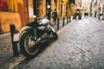 photograph-of-motorcycle-parked-beside-park-bars-near-woman[...].jpg