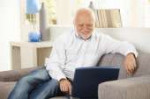 older-man-smiling-computer-screen-home-16618169.jpg