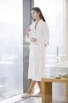 focused182376070-stock-photo-woman-bathrobe-holding-coffee-[...].jpg