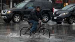 720917051315-ap-bicycle-rain-img[1].jpg