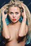 128745419-portrait-of-the-beautiful-naked-woman-with-pigtails-in-underwear-studio-shooting-with-dark.jpg