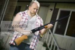 640-01358472em-overweight-man-with-a-shotgun-stock-photo.jpg