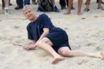 Arsene-Wenger-lays-in-the-sand-whilst-playing-a-game-of-foo[...].jpg