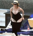 christina-hendricks-in-black-one-piece-swimsuit-italy-may-2[...].jpg