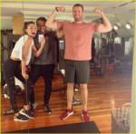 armie-hammer-flexes-biceps-elizabeth-chambers.jpg