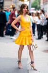 alison-brie-looks-cute-in-a-yellow-dress-while-visiting-bui[...].jpg