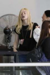 elle-fanning-make-up-free-prepares-to-catch-a-flight-out-of[...].jpg