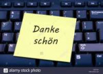 danke-schn-written-on-a-sticky-yellow-post-it-note-sitting-[...].jpg