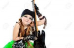 9322070-shot-of-a-little-girl-playing-rock-music-with-elect[...].jpg