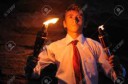 3720972-Young-businessman-lighting-with-torch-in-a-cave-Sto[...]