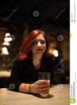 girl-pub-drinking-craft-beer-listening-to-his-boyfriend-wat[...].jpg