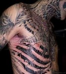Biomechanical-Skeleton-Tattoo-On-Man-Chest-And-Side-Rib.jpg