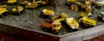 sandbox-of-yellow-toy-trucks.jpg