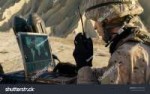 stock-photo-soldier-is-using-laptop-computer-and-radio-for-[...].jpg