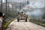 A Turkish-backed Free Syrian Army fighter fires from a tank[...].jpg