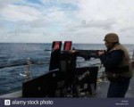 us-navy-gunners-mate-3rd-class-eric-adkins-fires-a-50-calib[...].jpg