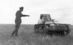 советский солдат смеётся над японским танком.jpg