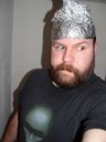 man-wearing-aluminum-foil-thinking-cap[1]