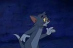 TomandJerryTheMovie-Tomlookingatthealleycats.png