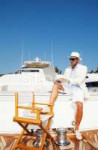 18235292-elegant-businessman-on-yacht-working-with-laptop.jpg