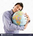 young-asian-man-holding-globe-with-happy-expression-on-his-[...].jpg